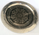 Plateau rond artisanal marocain de 40cm en metal argente finement cisele avec des motifs carres de 6cm inscrits dans un octogone