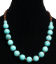 Collier ethnique artisanal imitation boules bleues vertes separees de perles en bois