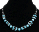 Collier ethnique artisanal imitation perles multicolores fusionnees agrementees de tubes noirs