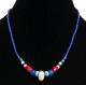 Collier ethnique artisanal imitation perles multicolores agrementees d'une pierre blanche au milieu
