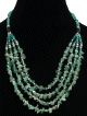 Collier ethnique artisanal quatre rangs imitation quartz vert agremente de perles vertes et en metal