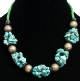 Collier ethnique artisanal turquoises imitation quartz agremente de boules argentees et perles vertes