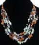 Collier ethnique quatre rangees de pierres colorees termine de perles et pieces argentees (vendu !)