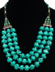 Collier traditionnel entierement fait main imitation turquoise agremente de perles et d'armatures argentees