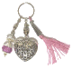 Porte-cles artisanal grand coeur et breloques en metal argente cisele et pompon en sabra rose